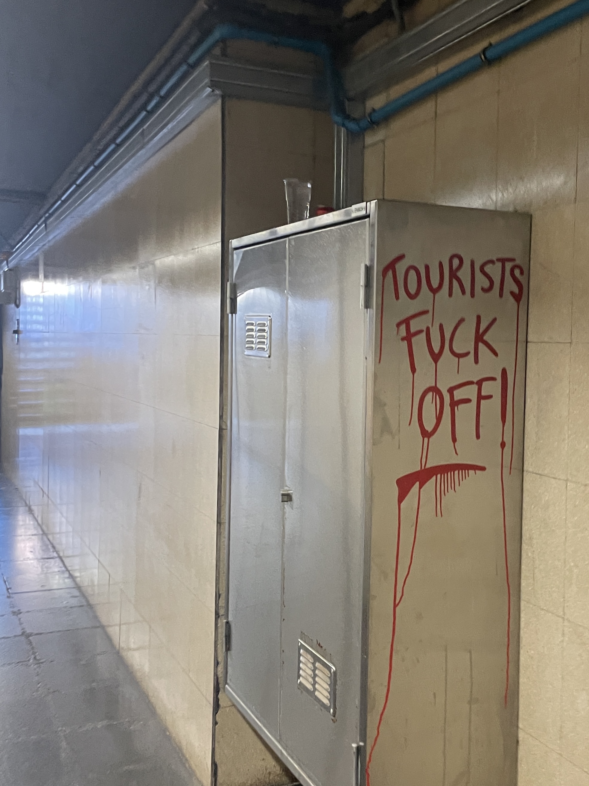 fuck off tourists graffiti